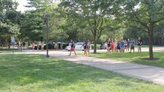 Freshmen walking to a picnic with their Student Orientation Guides during Welcome Week.