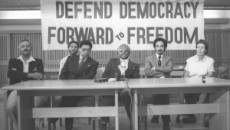 1988: The Rev. Allan Boesak (at table, second from left) sits with Archbishop Emeritus Desmond Tutu (center) and Mary Burton (far right) during the Defend the Democracy Campaign in South Africa. Burton reported concerns about money given to The Children's Trust, eventually resulting in an investigation of Boesak. (Photo from Getty Images)