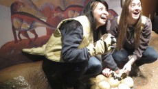 Ashley Asuncion and Cori Norton dressed up like dinosaurs to get the full effect of the Dinosphere exhibit.