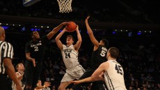 Xavier's James Farr blocks Kellen Dunham in the Musketeers' 67-61 overtime win over Butler in the Big East Tournament Quarterfinals.