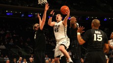 (Photo by Mike Andrews) Sophomore Andrew Chrabascz goes up for a shot during a 67-61 overtime loss against Xavier in the Big East Tournament Quarterfinals at Madison Square Garden.