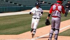 Sophomore Drew Small comes across the plate during a 7-5 loss against St. John's University at Victory Field in downtown Indianapolis. (Photo by Mike Andrews)