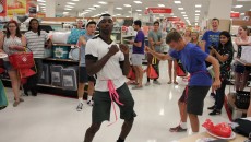 Jeremiah Peoples (left) and James Medernach (right) compete to knock the ping-pong balls out of the Kleenex box around their waists. Medernach won. Photo by Amy Street