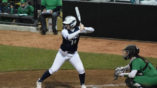 Freshman softball player strikes balance between taking her work seriously and keeping a light-hearted attitude
